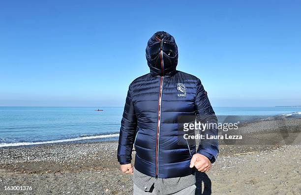 Italian comedian, blogger and political leader of the Five Stars Movement Beppe Grillo runs on the beach on March 3, 2013 in Marina di Bibbona, near...
