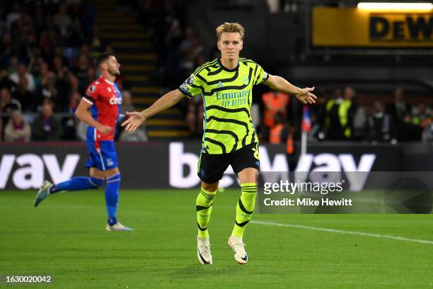 Martin Odegaard of Arsenal celebrates after scoring the team's first goal during the Premier League match between Crystal Palace and Arsenal FC at...