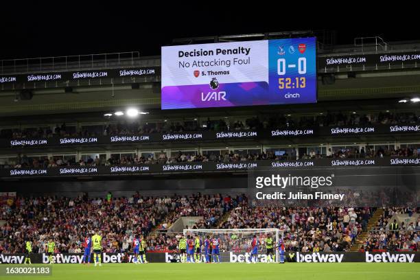 The digital screen displays a penalty decision for Arsenal following a VAR check during the Premier League match between Crystal Palace and Arsenal...