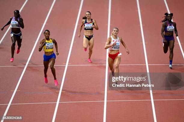 Sada Williams of Team Barbados and Natalia Kaczmarek of Team Poland compete in the Women's 400m Semi-Final during day three of the World Athletics...