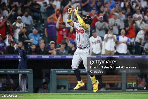 Ronald Acuna Jr. #13 of the Atlanta Braves celebrates a two-run home run in the fifth inning against the Colorado Rockies at Coors Field on August...