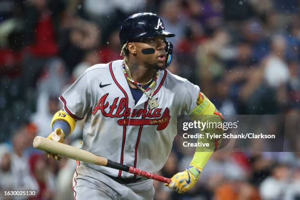 Ronald Acuna Jr. #13 of the Atlanta Braves hits a two-run home run in the fifth inning against the Colorado Rockies at Coors Field on August 28, 2023...