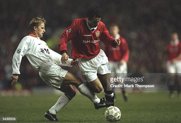 Ryan Giggs of Manchester United takes on the Kosice defence during the Champions League match at Old Trafford in Manchester, England. Manchester...