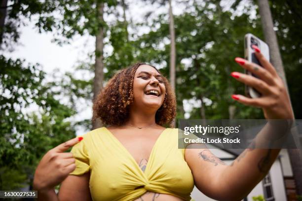 multi racial woman making selfie - online happy hour stock pictures, royalty-free photos & images