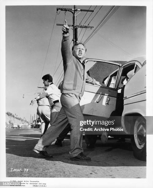 Mickey Rooney points to the sky in a scene from the film 'It's A Mad Mad Mad Mad World', 1963.