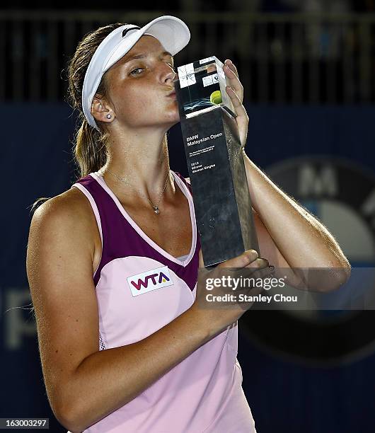 Karolina Pliskova of Czech Republic kisses her trophy after winning the Singles Final match against Bethanie Mattek-Sands of USA during the 2013 BMW...