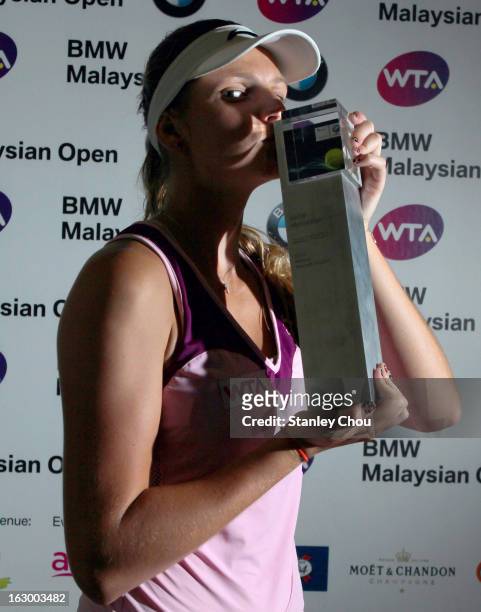 Karolina Pliskova of Czech Republic kisses her trophy after winning the Singles Final match against Bethanie Mattek-Sands of USA during the 2013 BMW...