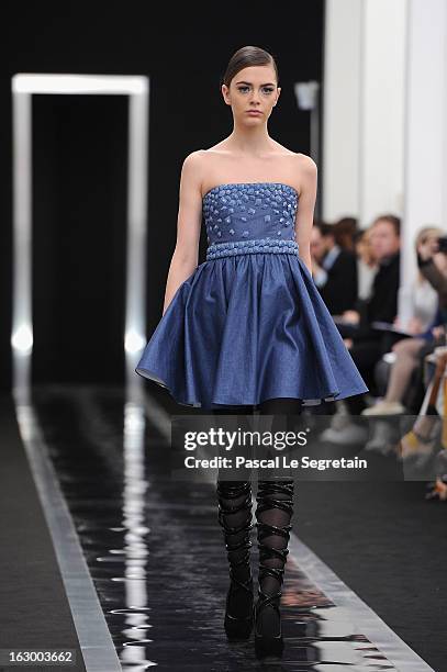 Model walks the runway during the Maxime Simoens Fall/Winter 2013 Ready-to-Wear show as part of Paris Fashion Week on March 3, 2013 in Paris, France.