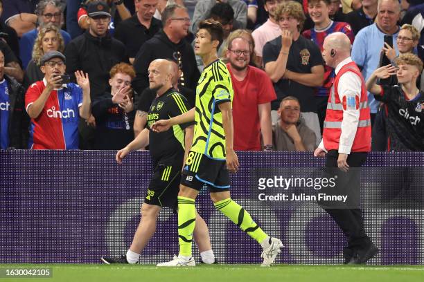 Takehiro Tomiyasu of Arsenal walks off the pitch after being sent off for a second yellow card during the Premier League match between Crystal Palace...