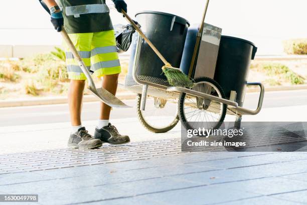worker sweeping footpath - street cleaner stock pictures, royalty-free photos & images