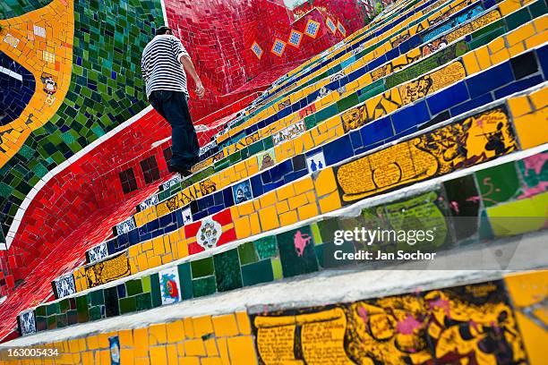 Man climbs the Selaron's Stairs , a mosaic staircase made of colorful tiles, in Rio de Janeiro, Brazil, 12 February 2012. World-famous staircase,...