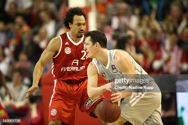 Demond Greens of Munich challenges Casey Jacobsen of Baskets during the BBL-match between Bayern Muenchen v Brose Baskets at Audi-Dome on March 3,...