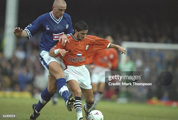 Benito Carbone of Sheffield Wednesday holds off the challenge of Matt Elliott of Leicester City during the FA Carling Premiership match at Filbert...