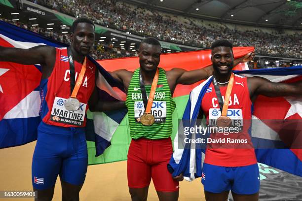 Silver medalist Lazaro Martinez of Team Cuba, gold medalist Hugues Fabrice Zango of Team Burkina Faso, and bronze medalist Cristian Napoles of Team...