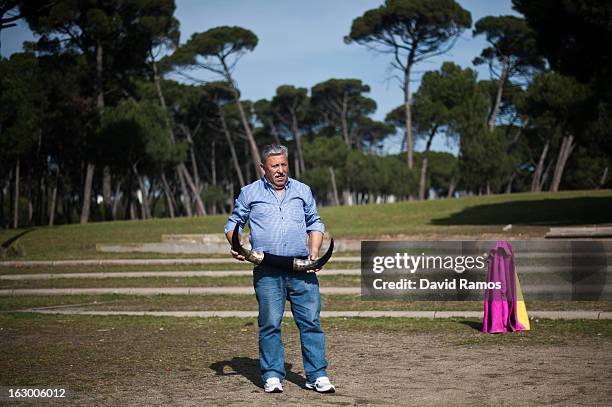 Antonio Guillen holds bull horns as he practices bullfighting in a city park in Santa Perpetua de la Mogoda on March 3, 2013 in Barcelona, Spain. On...