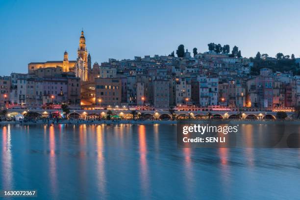 cityscape of menton at night, a historic town in the provence-alpes-côte d'azur region on the french riviera - south of france stockfoto's en -beelden