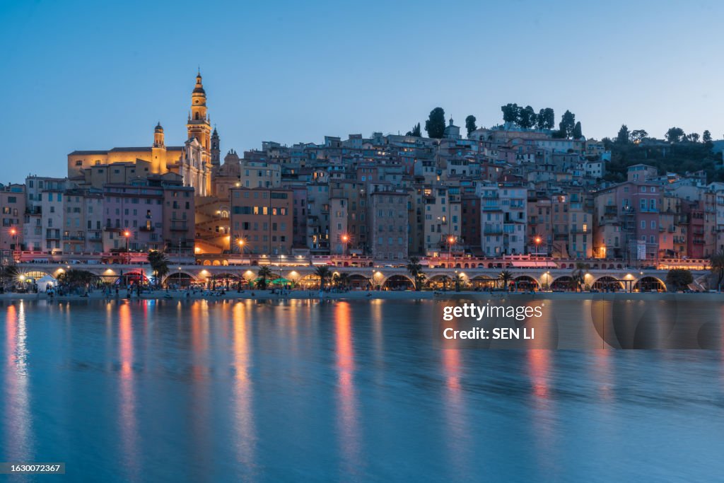 Cityscape of Menton at night, a historic town in the Provence-Alpes-Côte d'Azur region on the French Riviera