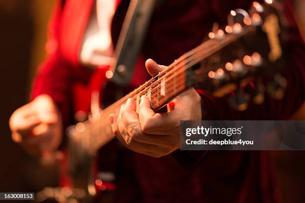 guitar player on stage - guitar stock pictures, royalty-free photos & images