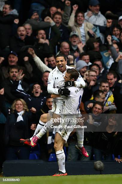 Aaron Lennon of Spurs celebrates with teammate Scott Parker after scoring his team's second goal during the Barclays Premier League match between...