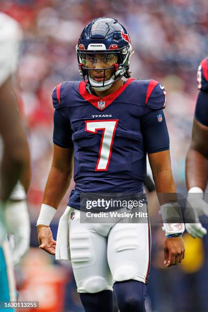 Stroud of the Houston Texans looks over the offense during the preseason game against the Miami Dolphins at NRG Stadium on August 19, 2023 in...