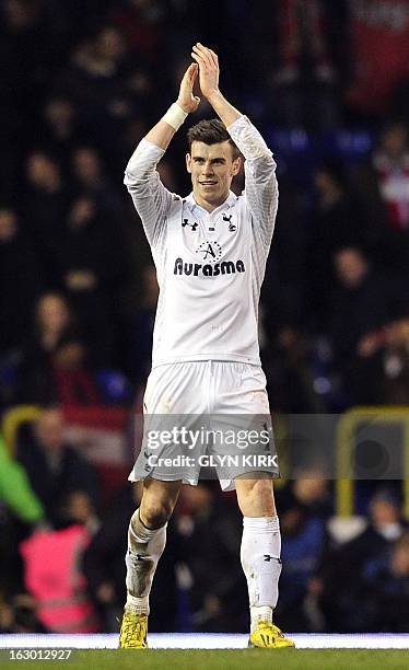 Tottenham Hotspur's Welsh defender Gareth Bale thanks the fans after winning the English Premier League football match against Arsenal at White Hart...