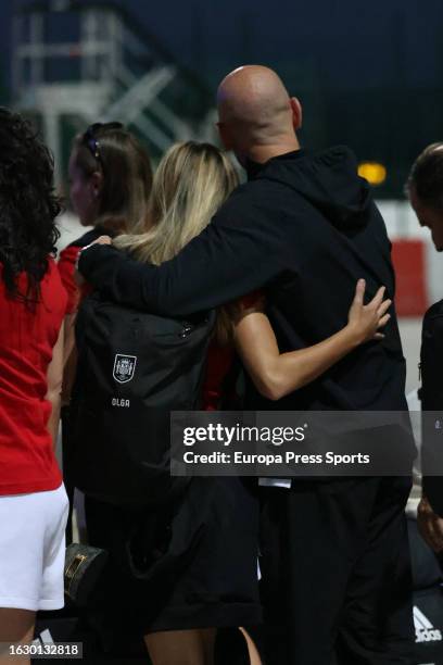 Spain women's national football player Olga Carmona and Spanish football federation president Luis Rubiales share a hug as they arrive for the...