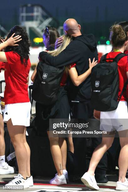 Spain women's national football player Olga Carmona and Spanish football federation president Luis Rubiales share a hug as they arrive for the...