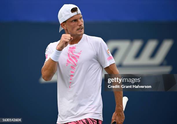 Marton Fucsovics of Hungary reacts during his match against Zhizhen Zhang of China during Day Two of the Winston-Salem Open at Wake Forest Tennis...