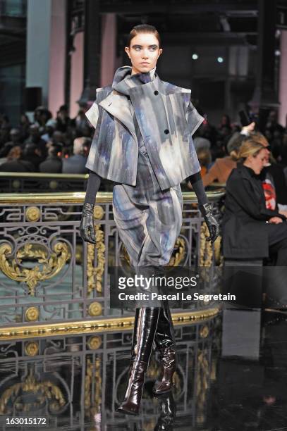 Model walks the runway during the John Galliano Fall/Winter 2013 Ready-to-Wear show as part of Paris Fashion Week at Le Centorial on March 3, 2013 in...