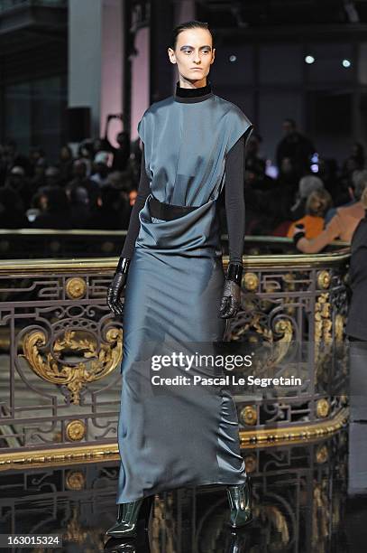 Model walks the runway during the John Galliano Fall/Winter 2013 Ready-to-Wear show as part of Paris Fashion Week at Le Centorial on March 3, 2013 in...