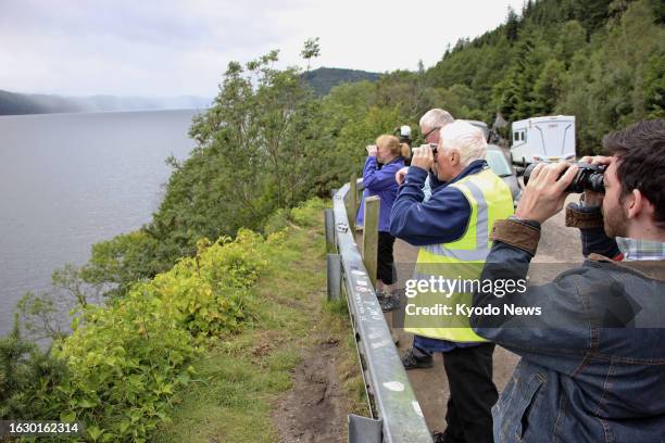 Volunteers watch the surface of Loch Ness in the Highlands of Scotland on Aug. 27 for signs of the legendary monster Nessie. Two groups undertook the...