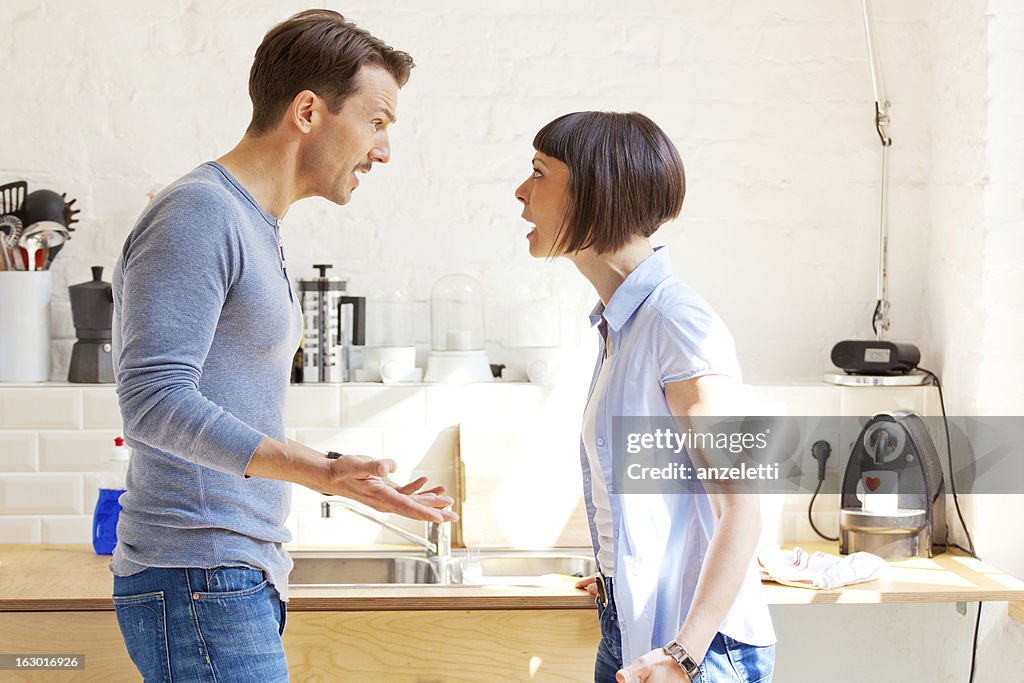 Couple having a discussion in the kitchen