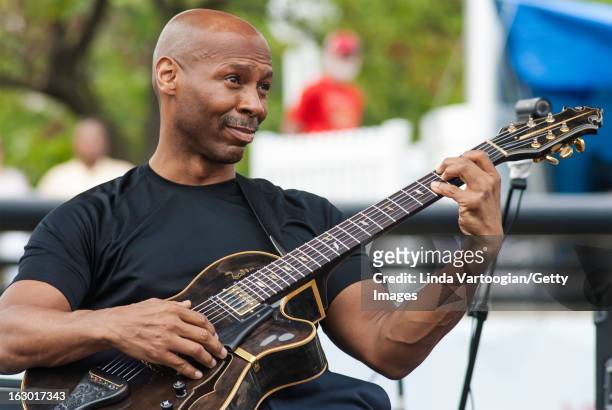 American jazz guitarist Kevin Eubanks leads his trio on the Carhartt Amphitheatre Stage at the 33rd Annual Detroit Jazz Festival, Detroit, Michigan,...