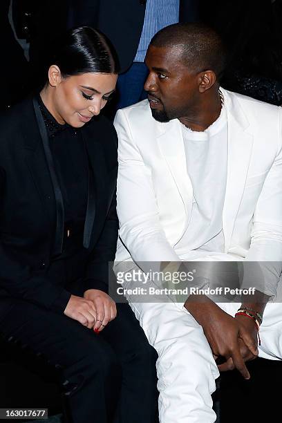 Kim Kardashian and Kanye West attend the Givenchy Fall/Winter 2013 Ready-to-Wear show as part of Paris Fashion Week on March 3, 2013 in Paris, France.