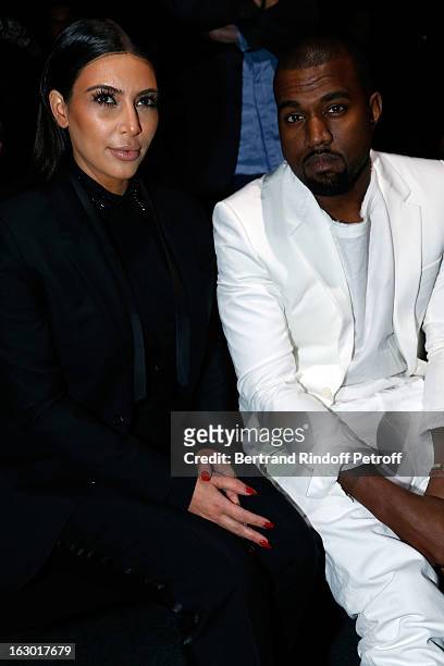 Kim Kardashian and Kanye West attend the Givenchy Fall/Winter 2013 Ready-to-Wear show as part of Paris Fashion Week on March 3, 2013 in Paris, France.