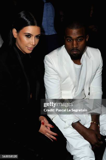 Kim Kardashian and Kanye West attend Givenchy Fall/Winter 2013 Ready-to-Wear show as part of Paris Fashion Week on March 3, 2013 in Paris, France.