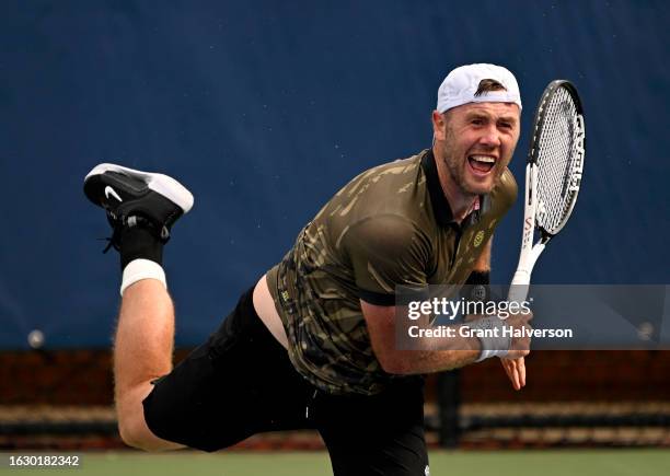 Illya Marchenko of Ukraine serves against Ricky Hijikata of Australia during Day Two of the Winston-Salem Open at Wake Forest Tennis Complex on...