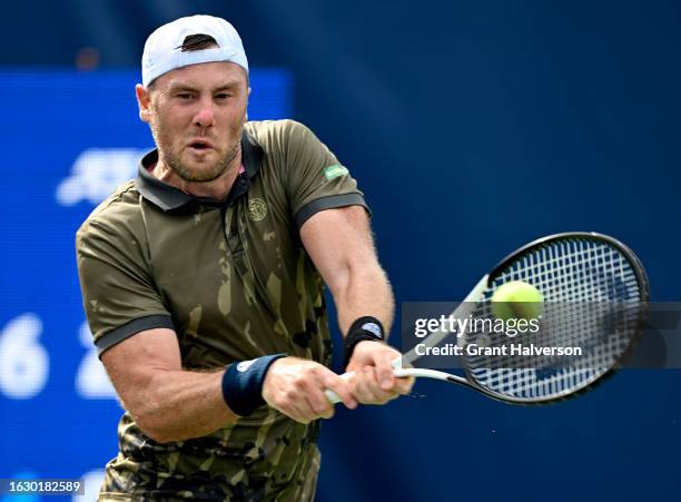 Illya Marchenko of Ukraine returns a shot against Ricky Hijikata of Australia during Day Two of the Winston-Salem Open at Wake Forest Tennis Complex...
