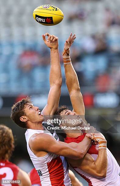 Tom Hickey of the St.Kilda Saints and Mike Pyke of the Sydney Swans contest for the ball during the round two AFL NAB Cup match between the St Kilda...