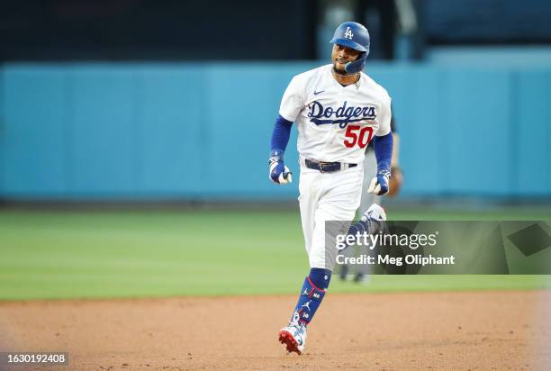 Mookie Betts of the Los Angeles Dodgers hits a home run in the first inning against the Miami Marlins at Dodger Stadium on August 18, 2023 in Los...