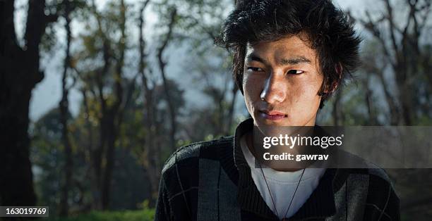 portrait of an asian young man - glimpses of daily life in nepal stock pictures, royalty-free photos & images