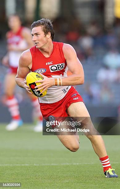 Jed Lamb of the Sydney Swans runs with the ball during the round two AFL NAB Cup match between the St Kilda Saints and the Sydney Swans at Etihad...