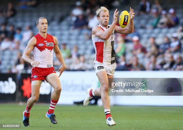 Beau Maister of the St.Kilda Saints marks the ball during the round two AFL NAB Cup match between the St Kilda Saints and the Sydney Swans at Etihad...