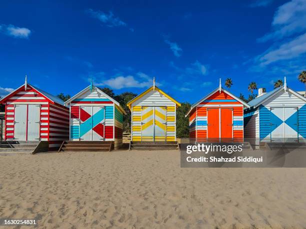 brighton bathing boxes - beach hut stock pictures, royalty-free photos & images