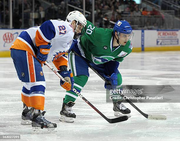 Chris Kreider of the Connecticut Whale and Aaron Ness of the Bridgeport Sound Tigers face off during an American Hockey League game on March 3, 2013...