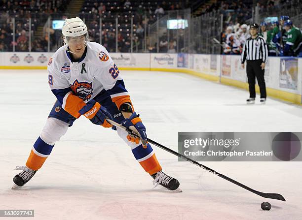 Brock Nelson of the Bridgeport Sound Tigers reaches for a pass during an American Hockey League game against the Connecticut Whale on March 3, 2013...