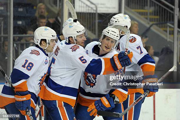 Brock Nelson of the Bridgeport Sound Tigers is congratulated after scoring a goal during an American Hockey League game against the Connecticut Whale...