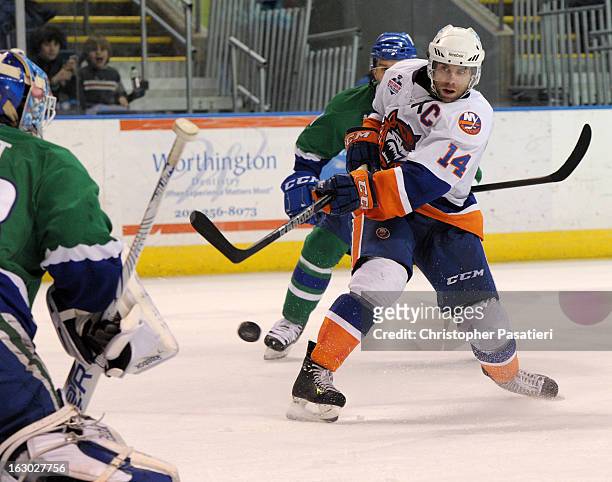 Matt Watkins of the Bridgeport Sound Tigers takes a shot on goal during an American Hockey League game against the Connecticut Whale on March 3, 2013...
