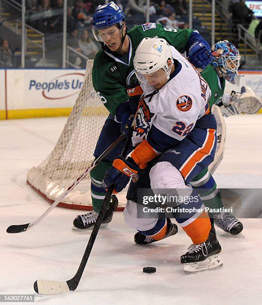 Nino Niederreiter of the Bridgeport Sound Tigers is checked by Blake Parlett of the Connecticut Whale during an American Hockey League on March 3,...