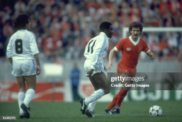 Graham Souness of Liverpool takes on Laurie Cunningham of Real Madrid during the European Cup final at Parc des Princes in Paris. Liverpool won the...